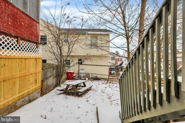 a front view of a house with a chair