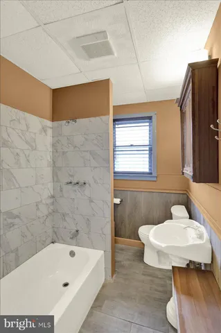 a bathroom with a sink and bathtub