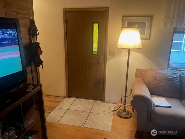 a bedroom with a bed and a lamp on the table