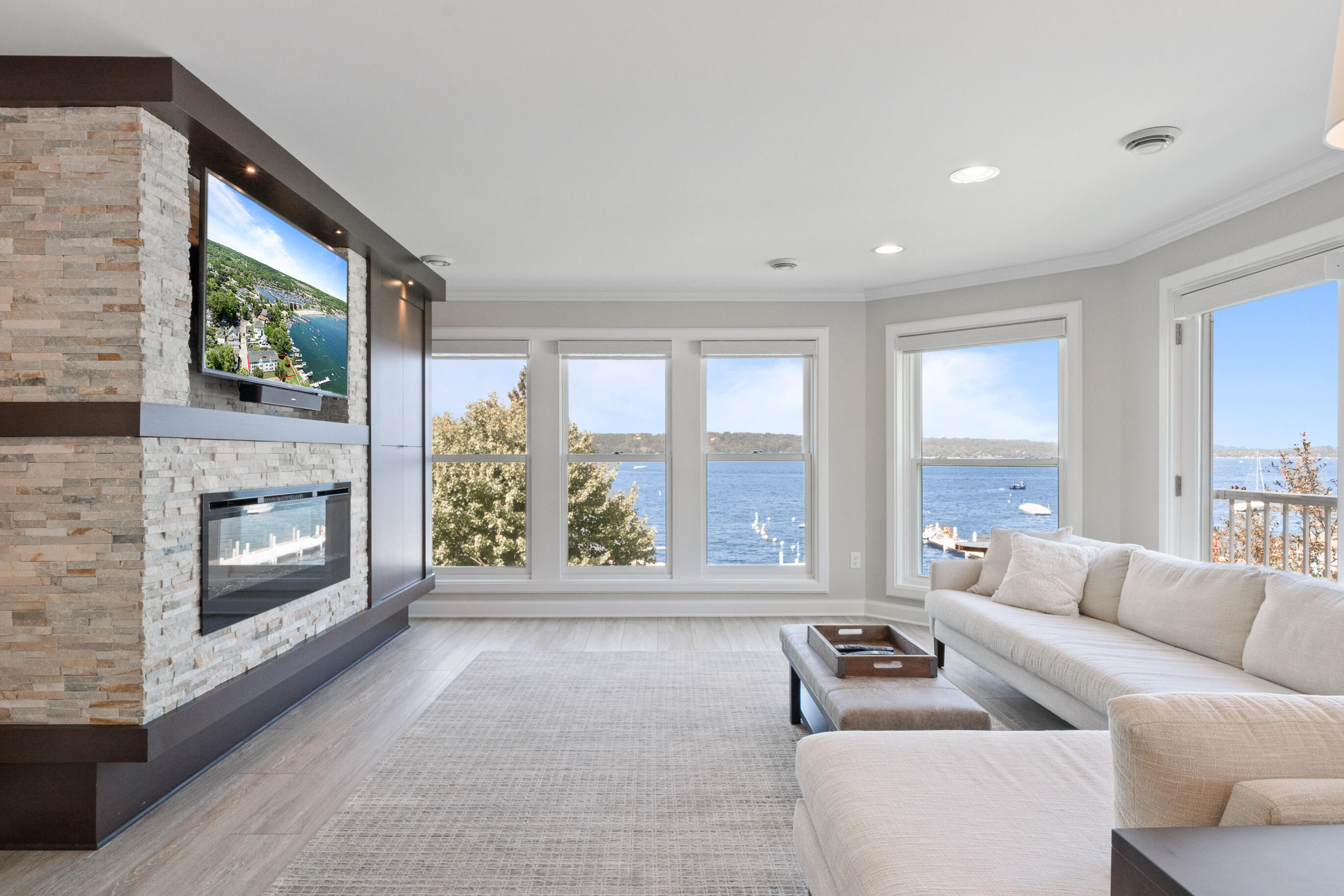 432 Harvard Avenue, Unit 5E 6F Fontana, WI 53125 - Photo 9 of 28 Stone surround media and fireplace to balance the water views