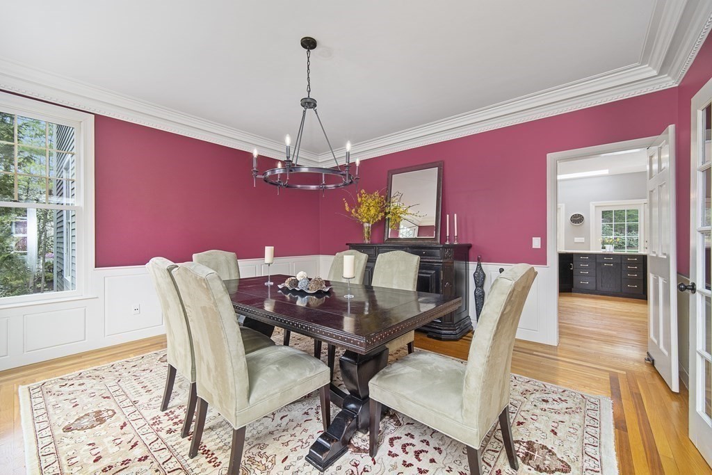 90 Ruddock Road Sudbury, MA 01776 - Photo 12 of 41 a dining room with furniture a chandelier and wooden floor