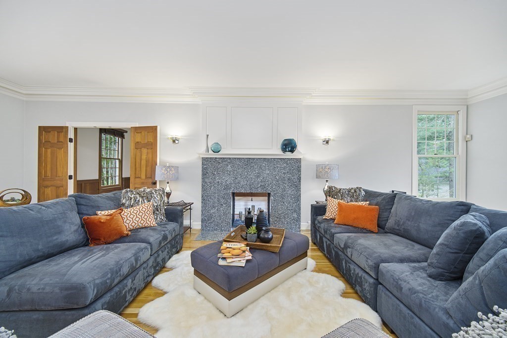 90 Ruddock Road Sudbury, MA 01776 - Photo 14 of 41 a living room with furniture and a fireplace