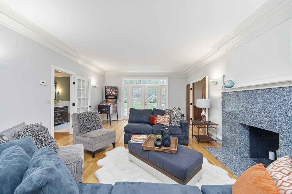 90 Ruddock Road Sudbury, MA 01776 - Photo 16 of 41 a living room with furniture and a fireplace