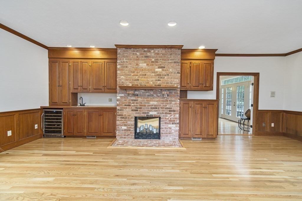 90 Ruddock Road Sudbury, MA 01776 - Photo 19 of 41 a view of a kitchen with furniture and a fireplace