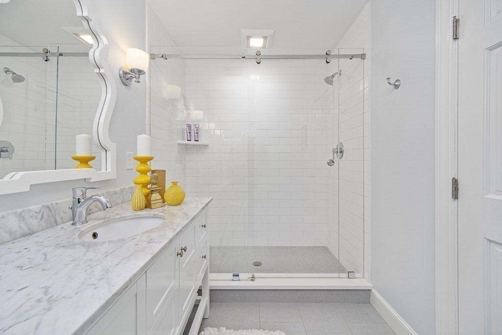 90 Ruddock Road Sudbury, MA 01776 - Photo 27 of 41 a bathroom with a tub sink vanity granite and shower