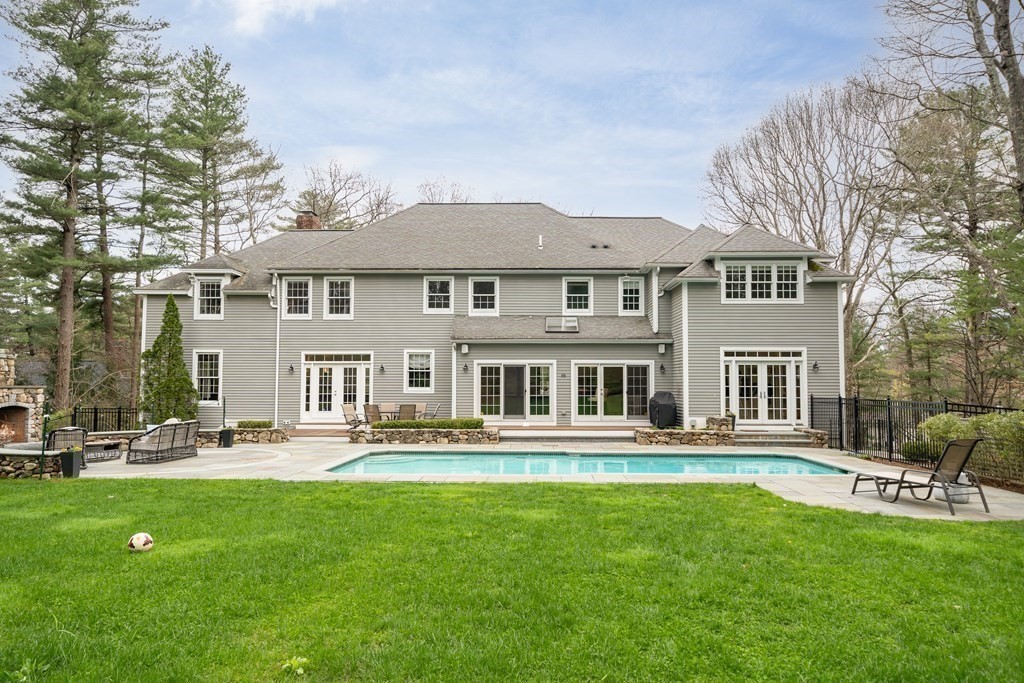 90 Ruddock Road Sudbury, MA 01776 - Photo 36 of 41 a front view of a house with a garden
