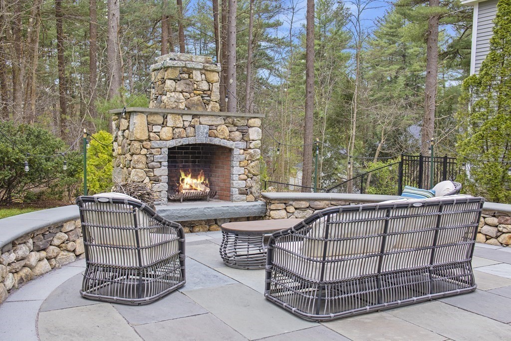 90 Ruddock Road Sudbury, MA 01776 - Photo 39 of 41 a view of a couches and a fireplace in the balcony