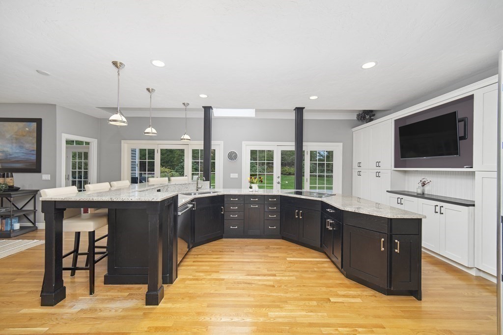 90 Ruddock Road Sudbury, MA 01776 - Photo 7 of 41 a large kitchen with stainless steel appliances granite countertop a sink and cabinets