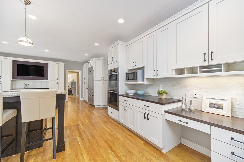 90 Ruddock Road Sudbury, MA 01776 - Photo 8 of 41 a kitchen with stainless steel appliances granite countertop a sink a stove and a refrigerator
