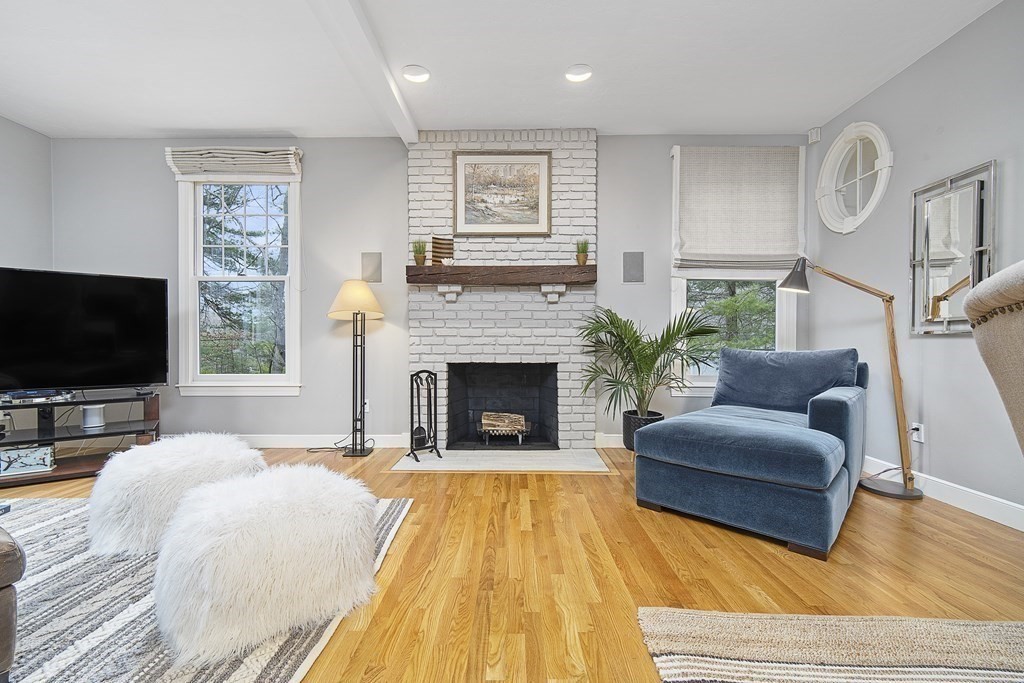 90 Ruddock Road Sudbury, MA 01776 - Photo 10 of 41 a living room with furniture and a fireplace