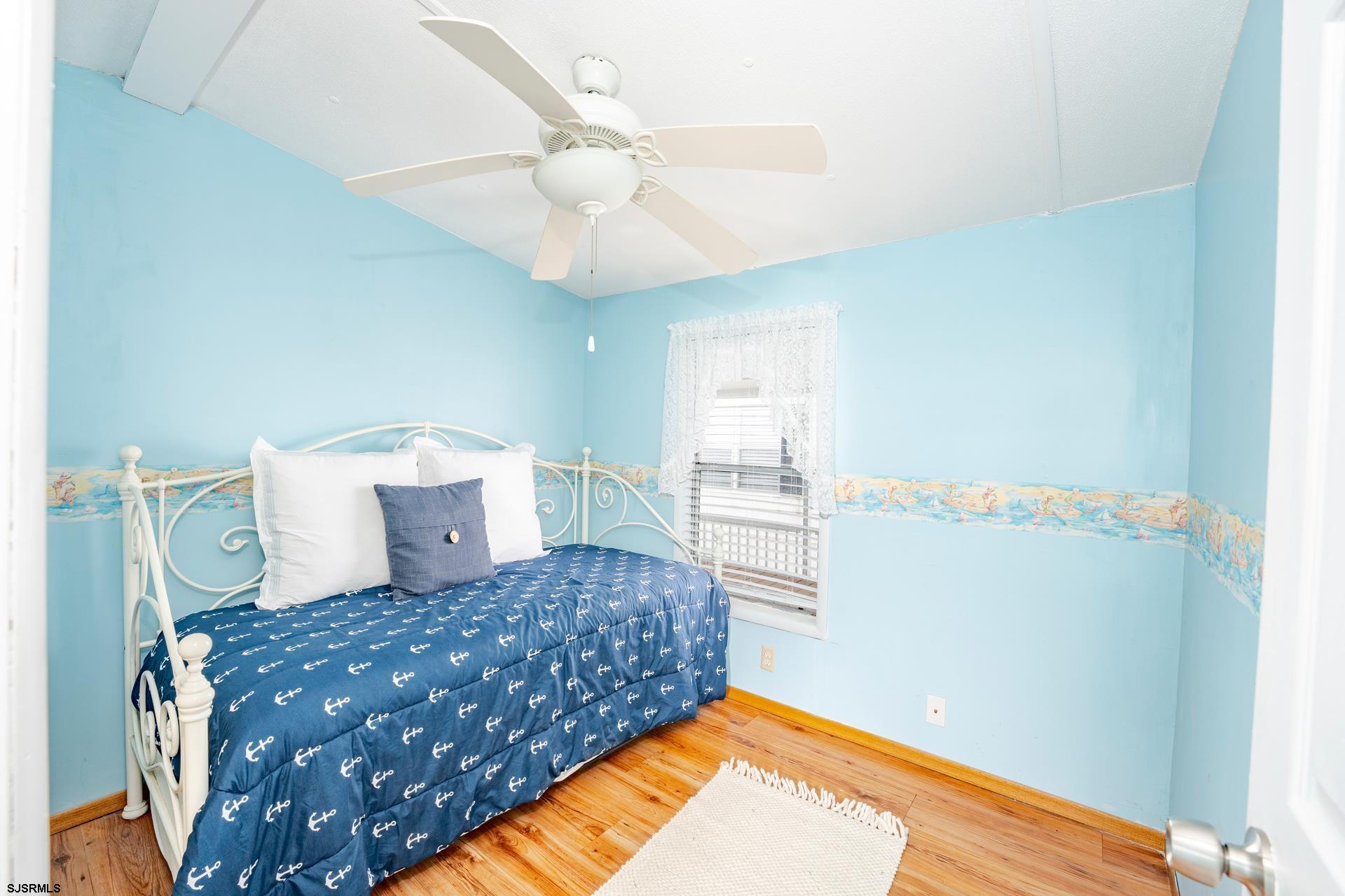 1810 Somers Point Road Egg Harbor Township, NJ 08234 - Photo 13 of 25 a bedroom with a bed and a chandelier