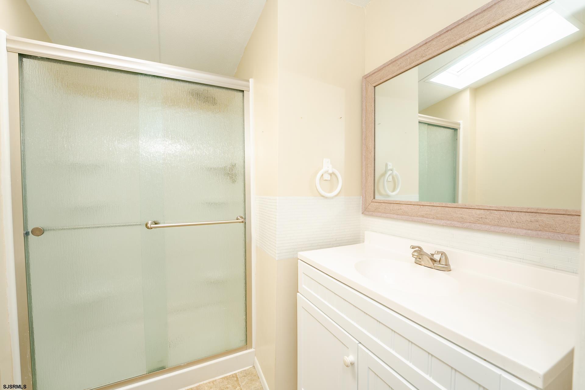 1810 Somers Point Road Egg Harbor Township, NJ 08234 - Photo 14 of 25 a bathroom with a shower and a sink