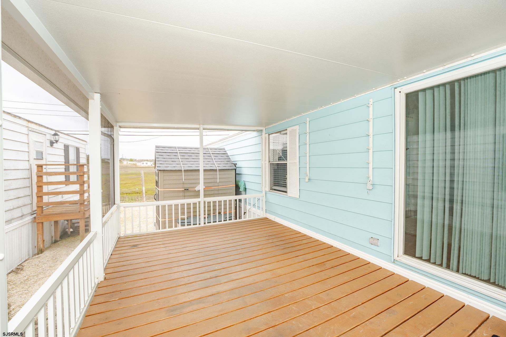 1810 Somers Point Road Egg Harbor Township, NJ 08234 - Photo 6 of 25 a bedroom with a bed and wooden floor
