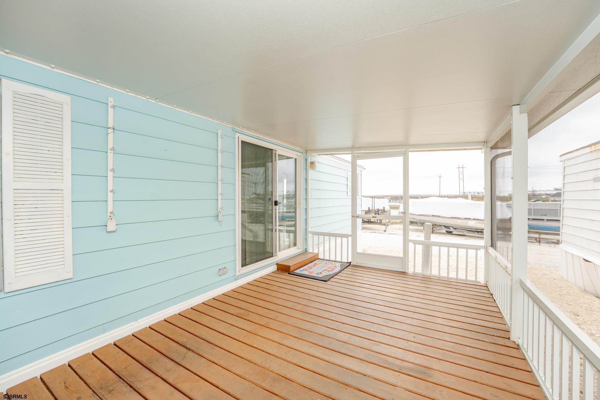 1810 Somers Point Road Egg Harbor Township, NJ 08234 - Photo 7 of 25 a swimming pool with wooden floor and balcony