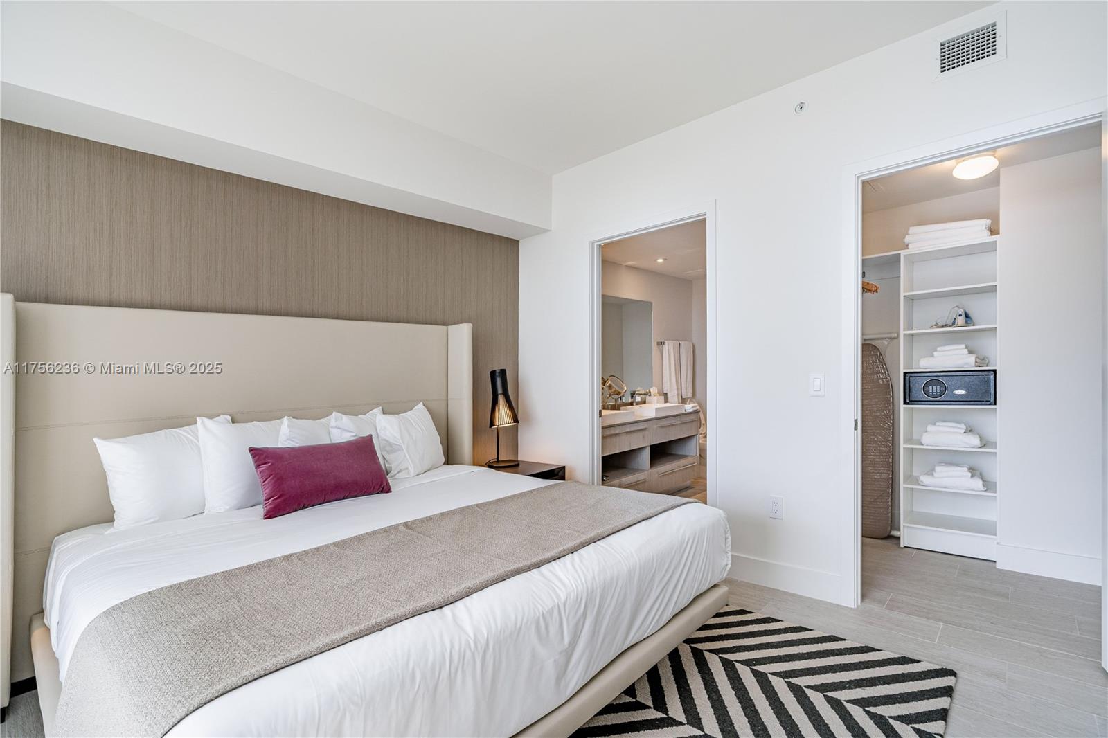 4010 South Ocean Drive, Unit R1609 Hollywood, FL 33019 - Photo 17 of 50 a bedroom with a bed and a walk in closet