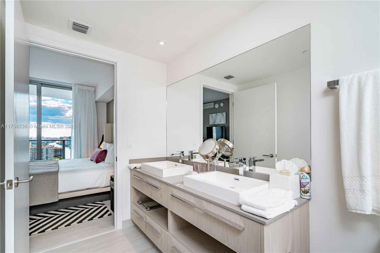 4010 South Ocean Drive, Unit R1609 Hollywood, FL 33019 - Photo 23 of 50 a bathroom with a sink double vanity and a mirror