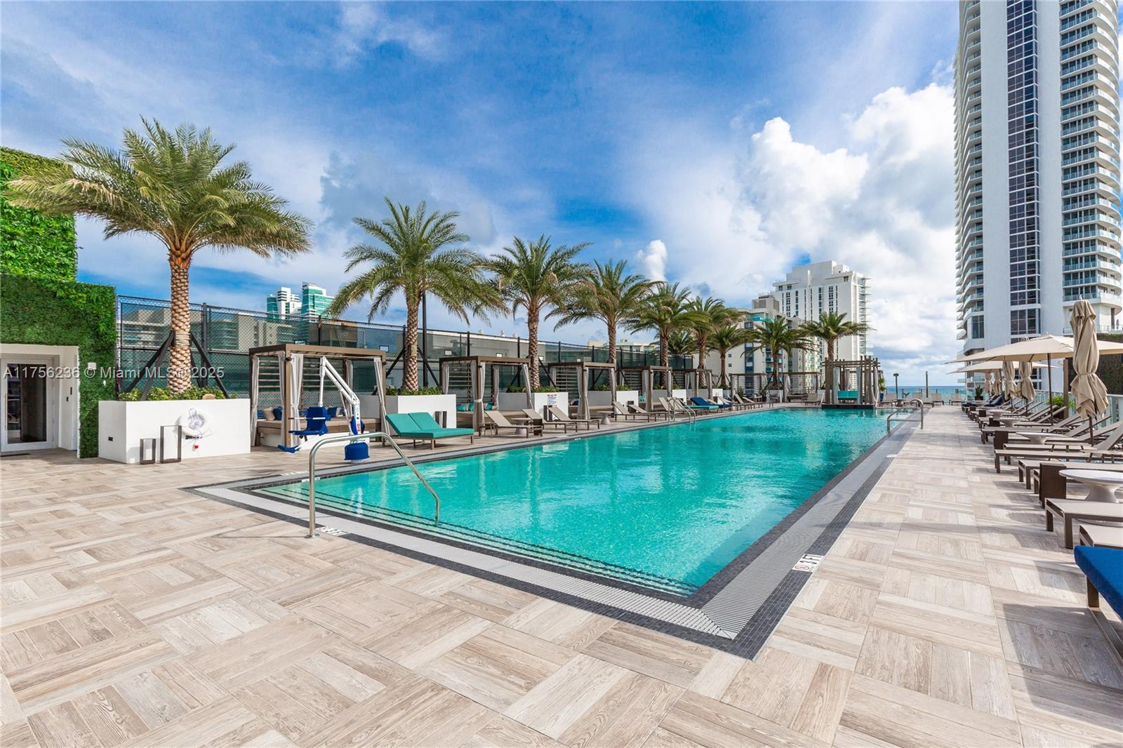 4010 South Ocean Drive, Unit R1609 Hollywood, FL 33019 - Photo 31 of 50 a view of a swimming pool with a patio
