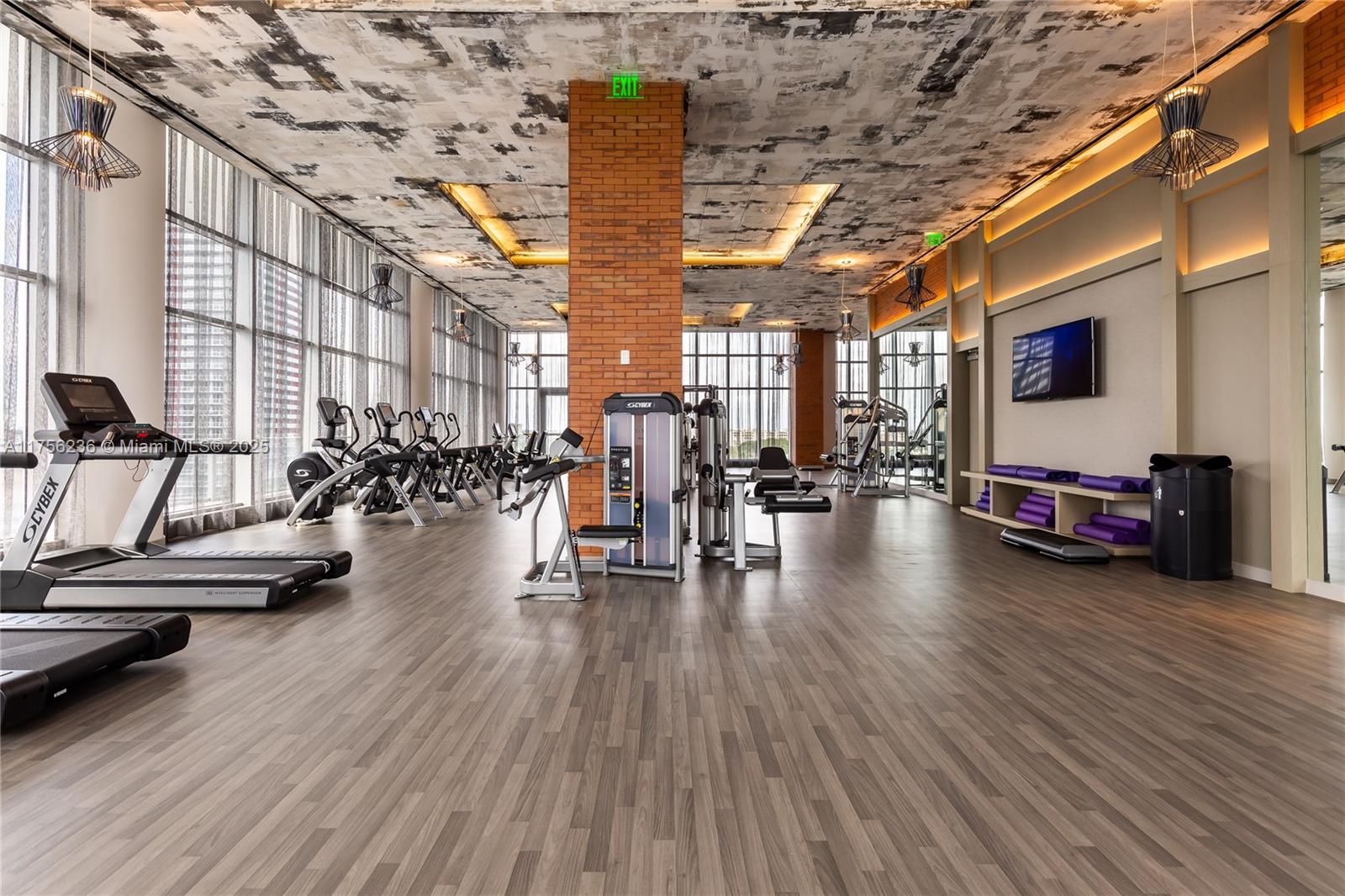 4010 South Ocean Drive, Unit R1609 Hollywood, FL 33019 - Photo 44 of 50 a view of a gym with wooden floor and a potted plant