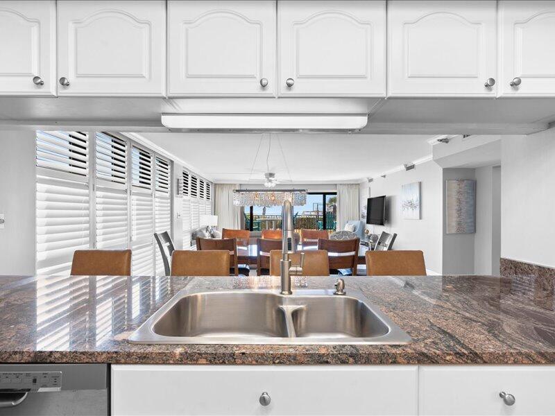 1044 Highway 98, Unit 101 Destin, FL 32541 - Photo 13 of 29 a kitchen with a sink and cabinets