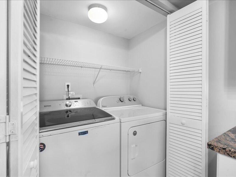 1044 Highway 98, Unit 101 Destin, FL 32541 - Photo 14 of 29 a utility room with dryer and washer