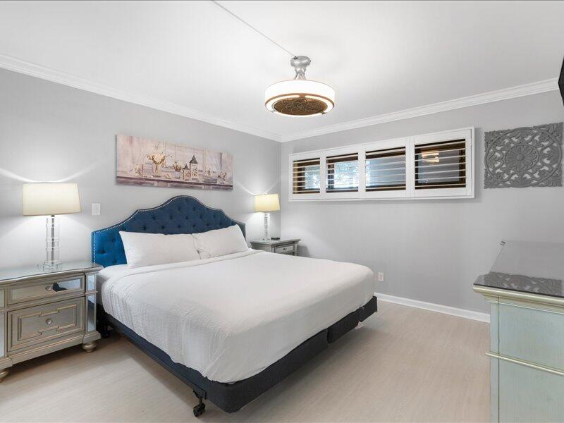 1044 Highway 98, Unit 101 Destin, FL 32541 - Photo 18 of 29 a bedroom with a bed and a window