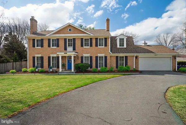 front view of a house next to a yard