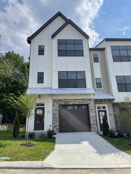 a front view of a house with a garage
