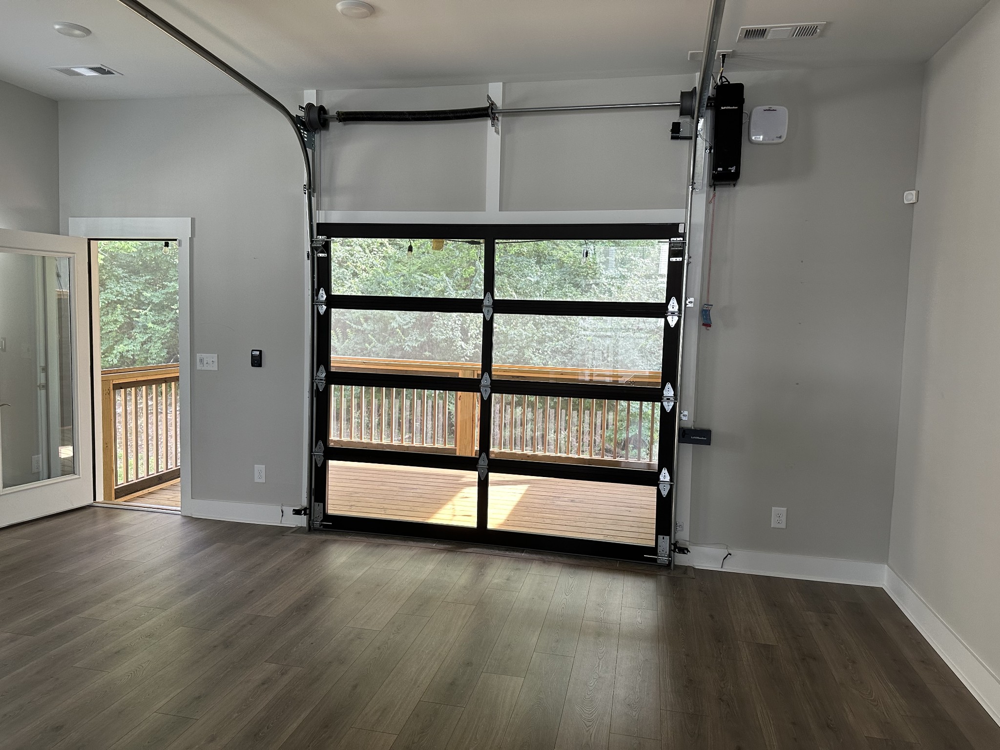 217 Stonecrest Drive, Unit 217 Nashville, TN 37209 - Photo 19 of 20 a view of empty room with wooden floor and fan