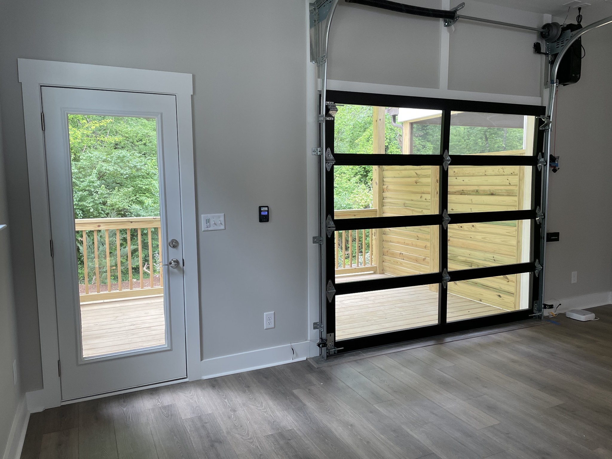 217 Stonecrest Drive, Unit 217 Nashville, TN 37209 - Photo 3 of 20 an empty room with wooden floor and windows