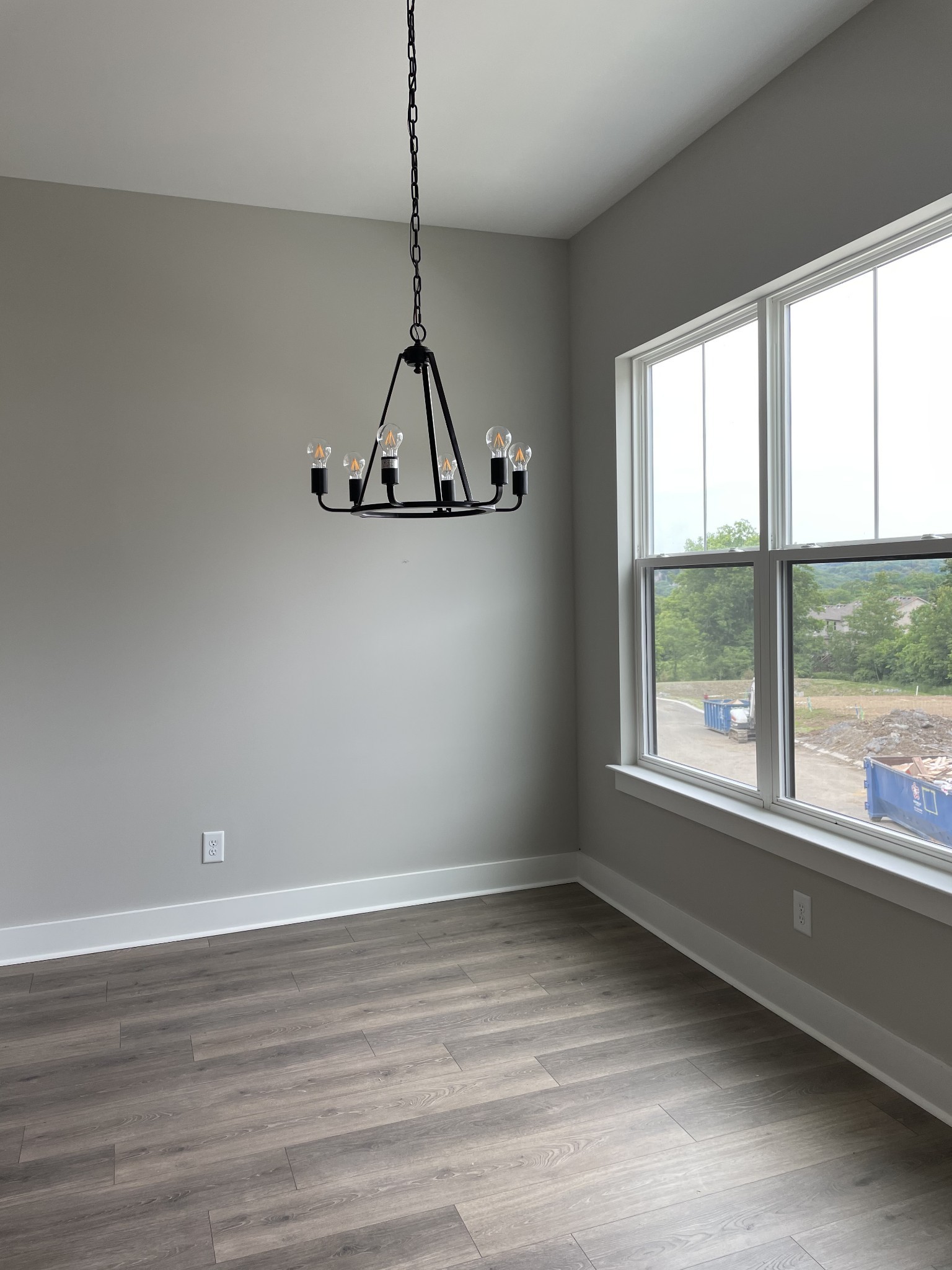 217 Stonecrest Drive, Unit 217 Nashville, TN 37209 - Photo 7 of 20 a view of a room with window a ceiling fan and wooden floor