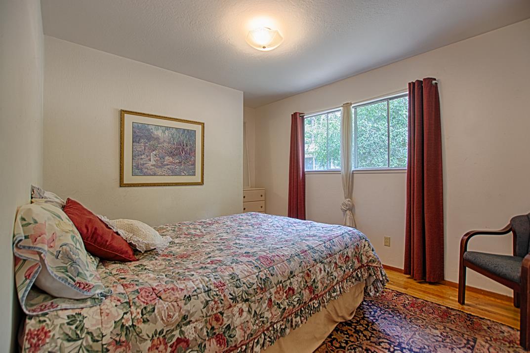 7 Plaza Mount Hermon, CA 95041 - Photo 18 of 26 a bedroom with a bed and a window
