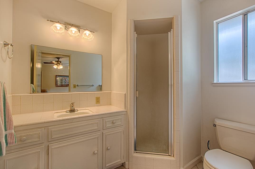 7 Plaza Mount Hermon, CA 95041 - Photo 20 of 26 a bathroom with a toilet sink and mirror