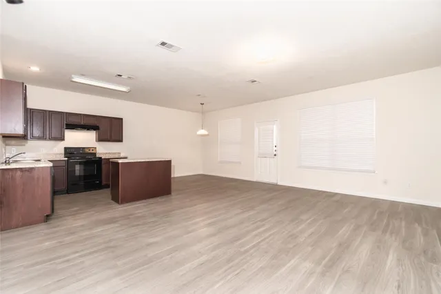a view of kitchen with wooden floor