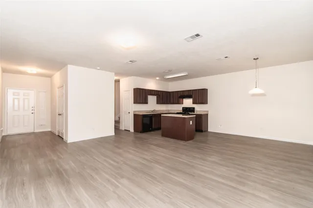a view of kitchen with wooden floor