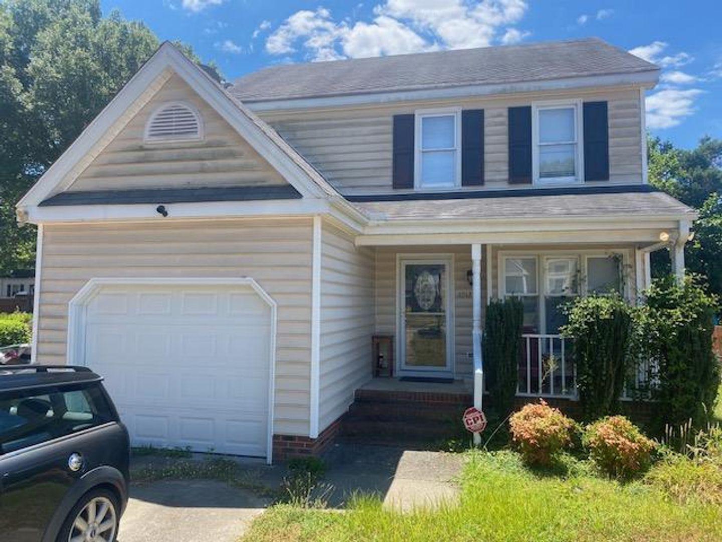 1917 Carthage Circle Raleigh, NC 27604 - Photo 1 of 15 a front view of a house with a yard