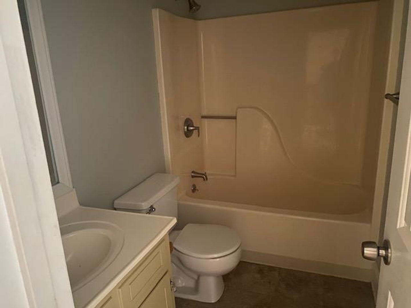 1917 Carthage Circle Raleigh, NC 27604 - Photo 11 of 15 a bathroom with a sink a toilet and shower