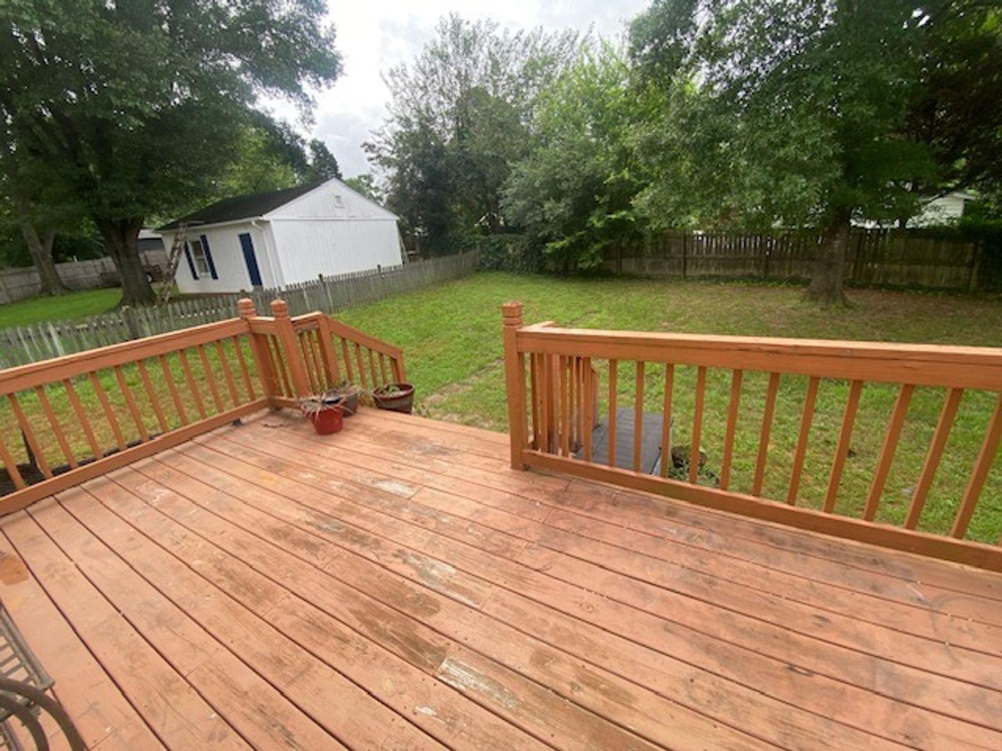 1917 Carthage Circle Raleigh, NC 27604 - Photo 13 of 15 a terrace view with wooden floor and fence