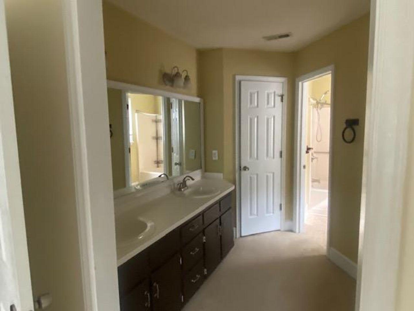 1917 Carthage Circle Raleigh, NC 27604 - Photo 8 of 15 a bathroom with a granite countertop sink mirror and double