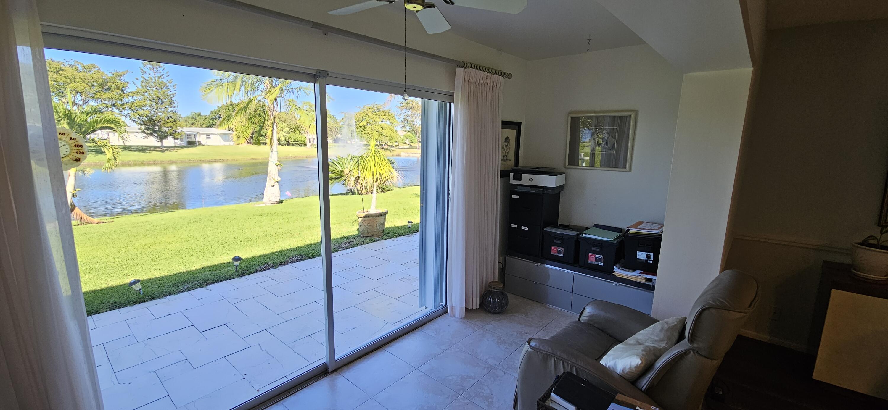 5213 Michael Drive West Palm Beach, FL 33417 - Photo 17 of 47 a living room with large window
