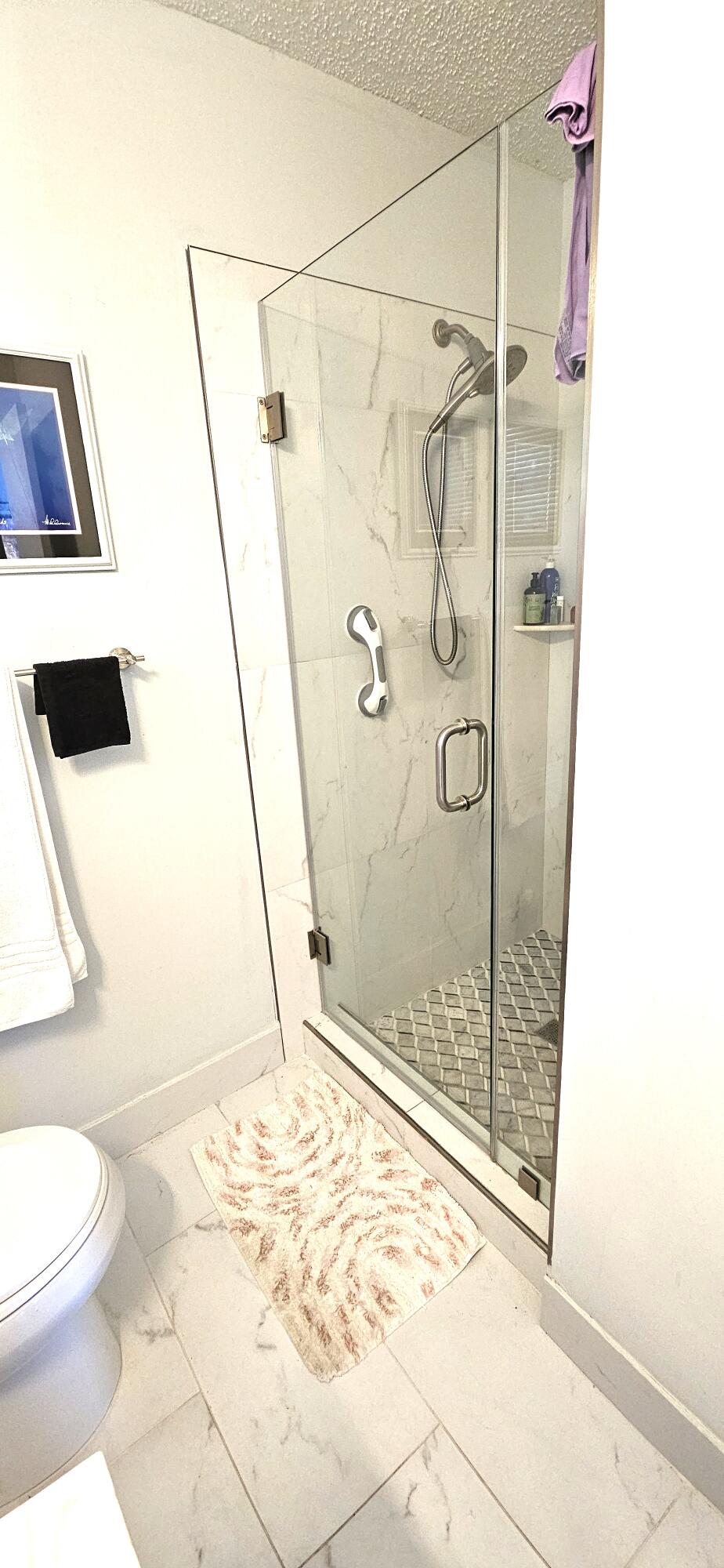 5213 Michael Drive West Palm Beach, FL 33417 - Photo 22 of 47 a bathroom with a shower and a toilet