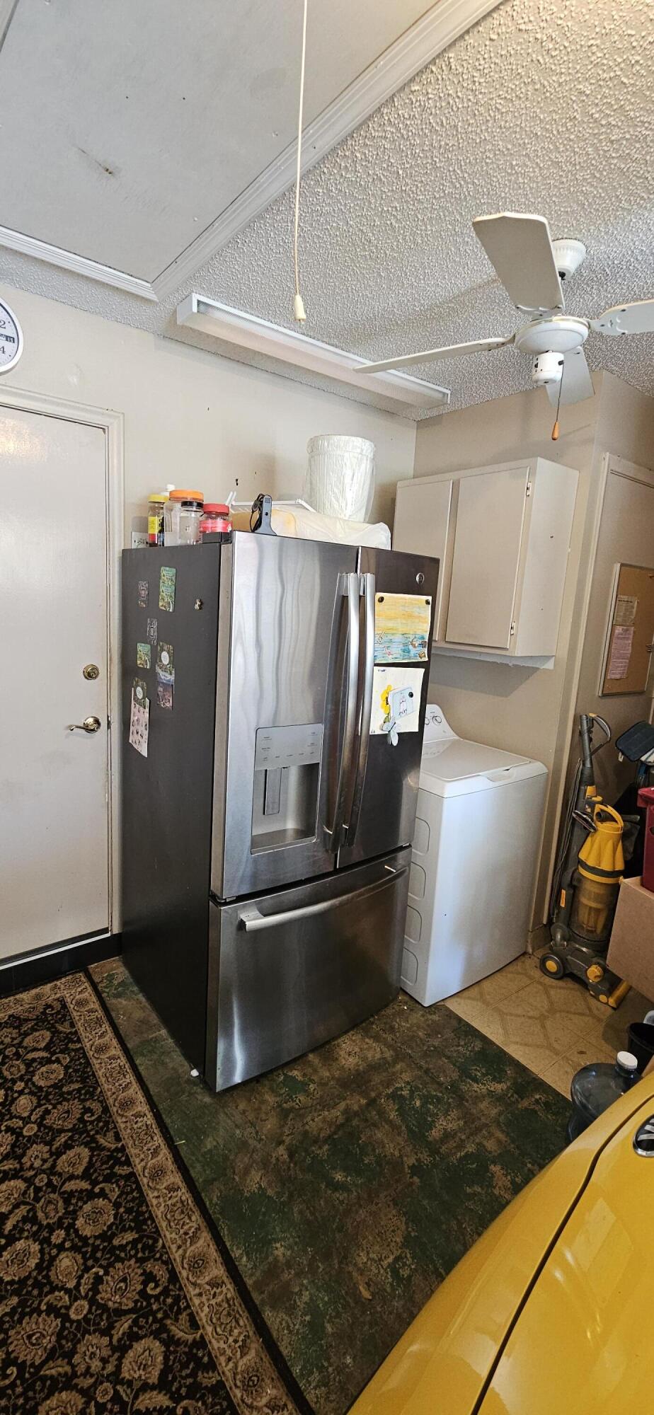 5213 Michael Drive West Palm Beach, FL 33417 - Photo 29 of 47 a kitchen with refrigerator and window