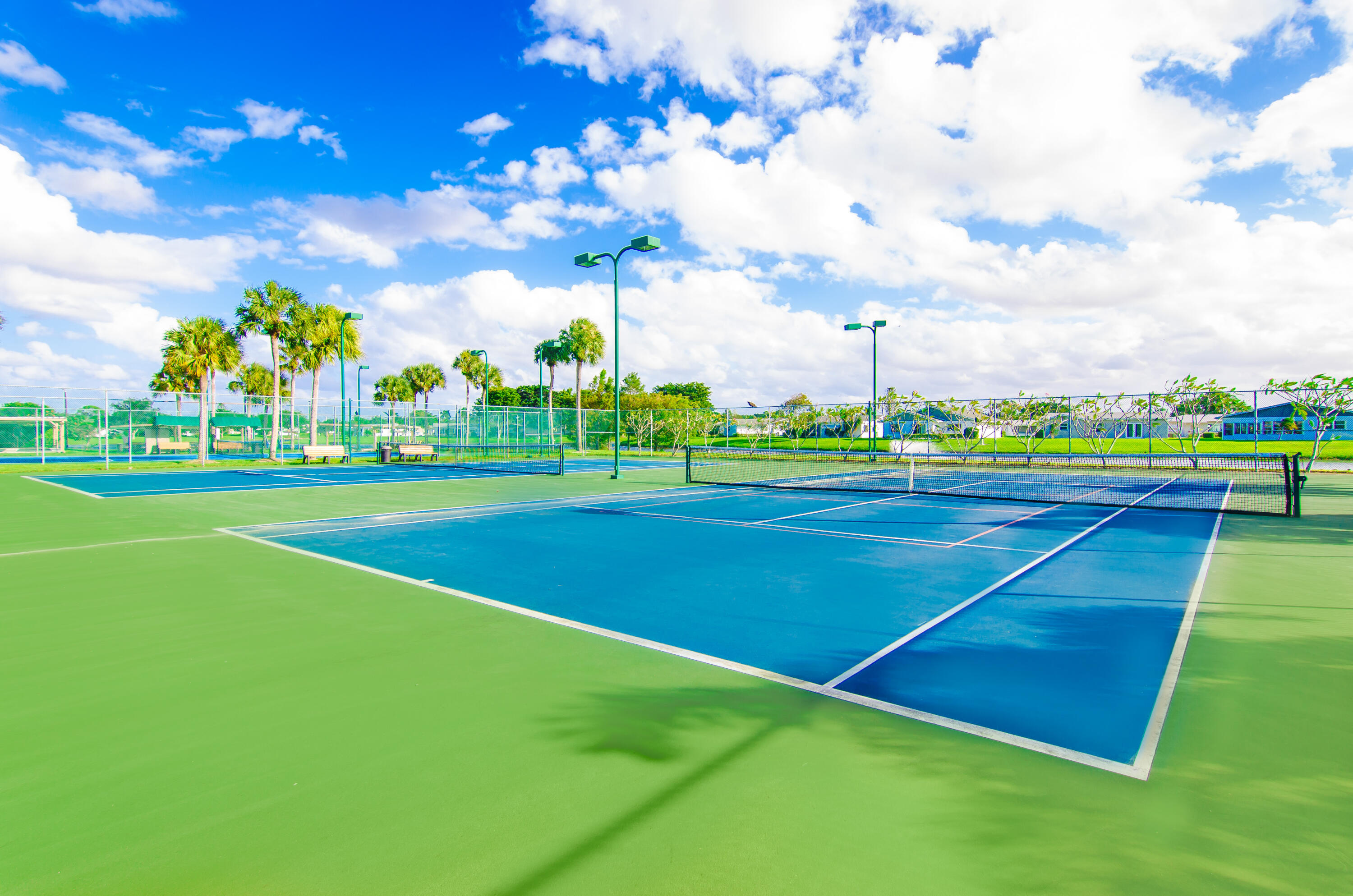 5213 Michael Drive West Palm Beach, FL 33417 - Photo 34 of 47 a view of an outdoor space and tennis court