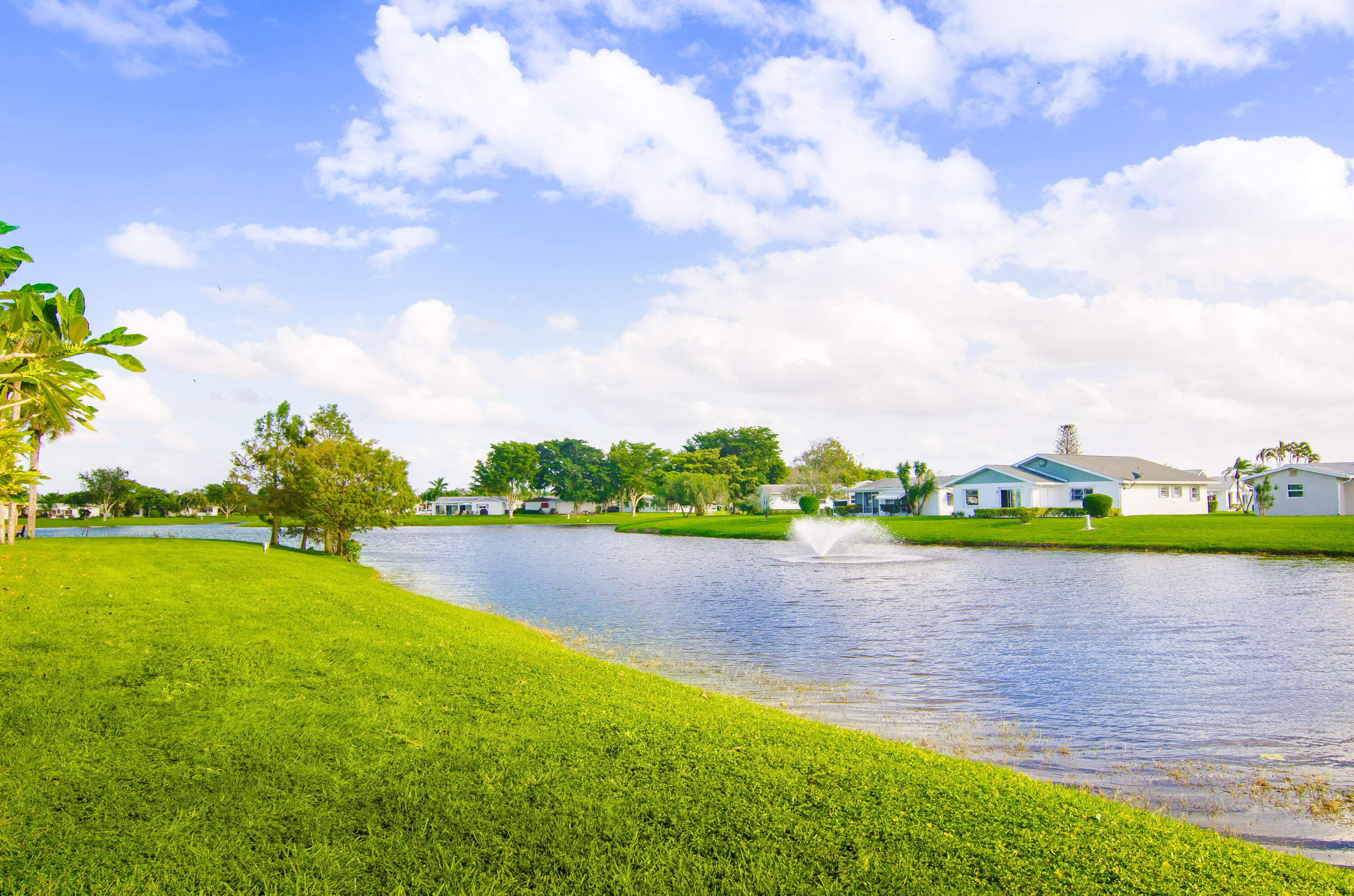 5213 Michael Drive West Palm Beach, FL 33417 - Photo 42 of 47 a view of a lake and houses in the back