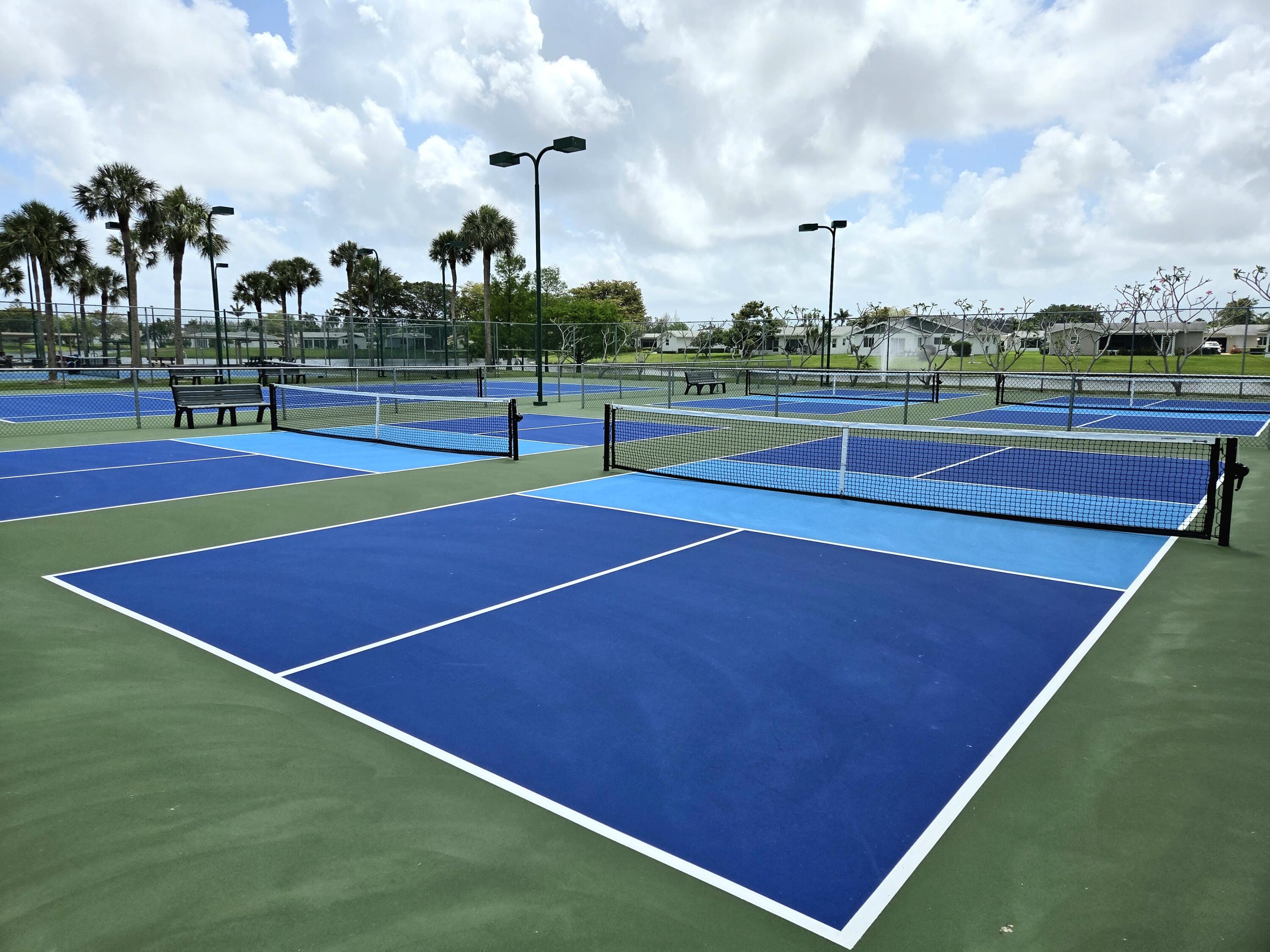 5213 Michael Drive West Palm Beach, FL 33417 - Photo 45 of 47 a view of an outdoor space and tennis court