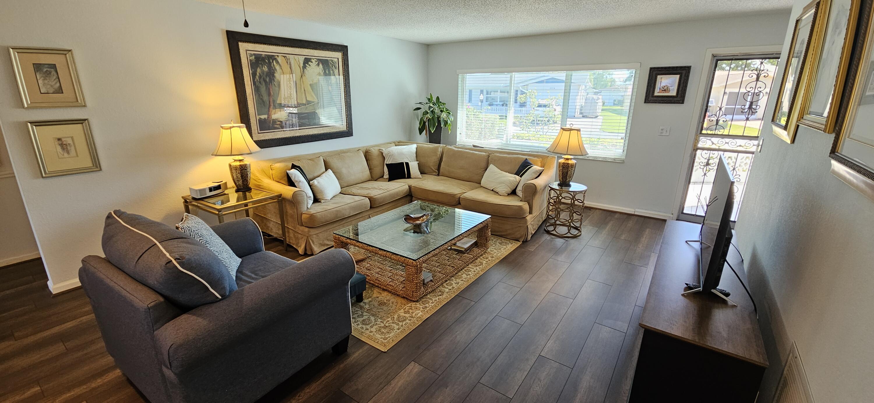 5213 Michael Drive West Palm Beach, FL 33417 - Photo 6 of 47 a living room with furniture and a wooden floor