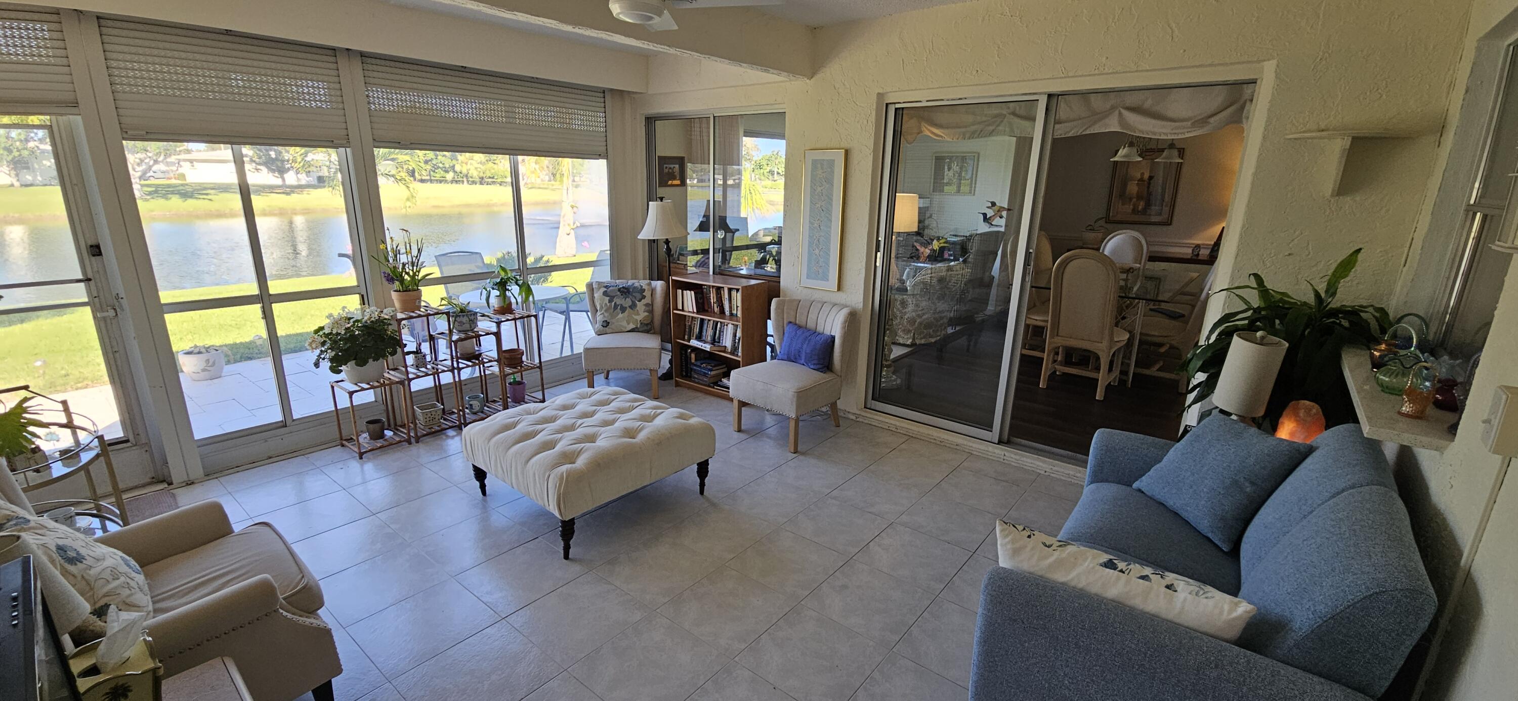 5213 Michael Drive West Palm Beach, FL 33417 - Photo 10 of 47 a living room with furniture and a large window