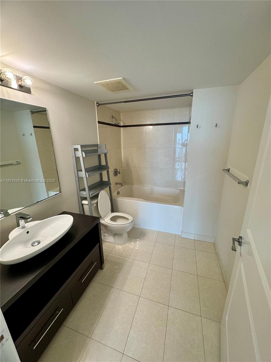 Edgewater Miami, FL 33137 - Photo 12 of 31 a bathroom with a sink a toilet and shower
