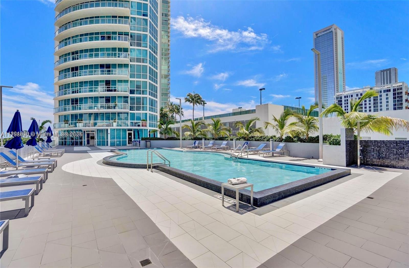 Edgewater Miami, FL 33137 - Photo 22 of 31 a view of a building with a swimming pool