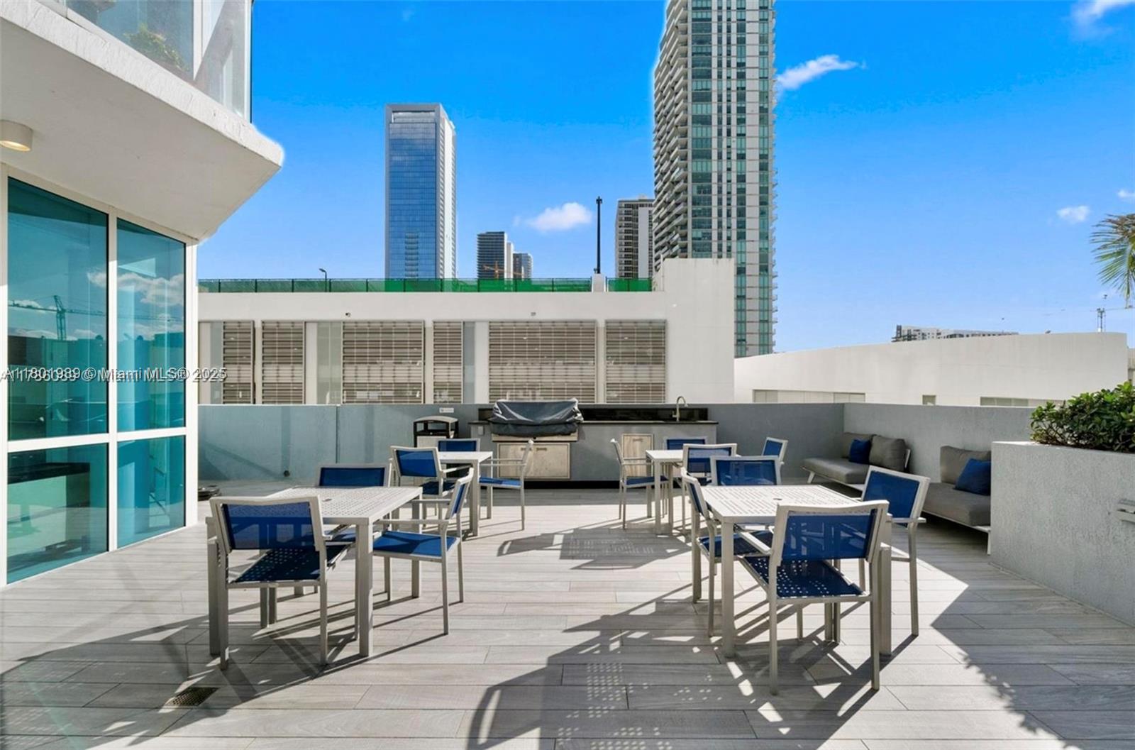 Edgewater Miami, FL 33137 - Photo 26 of 31 a building outdoor space with patio furniture
