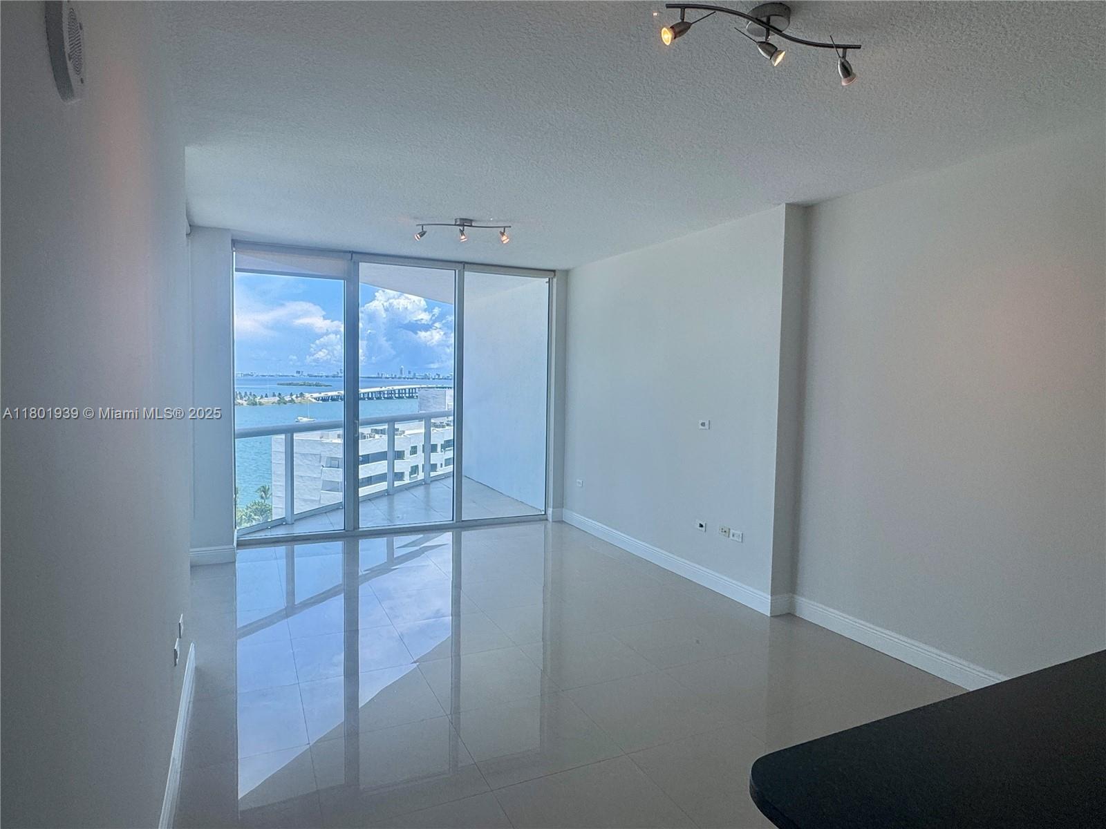 Edgewater Miami, FL 33137 - Photo 3 of 31 an empty room with windows